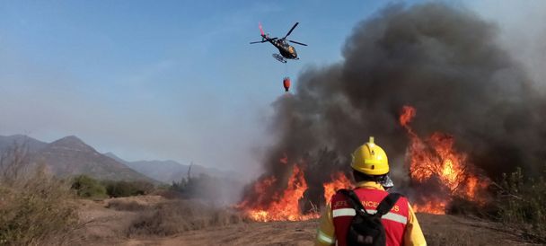 Airbus helicopter battling a blaze