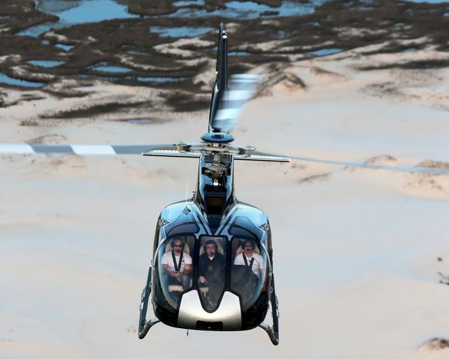 H130 em voo de turismo H130 em voo de turismo