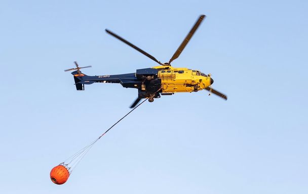 Ecocopter's Super Puma with water bucket