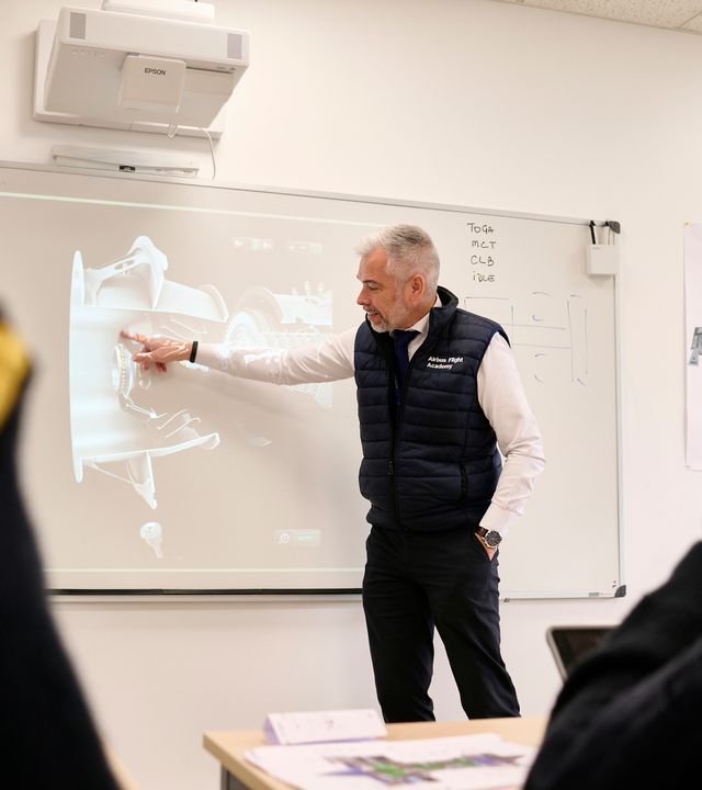 AFA - Male instructor teaching in front of class AFA - Male instructor teaching in front of class