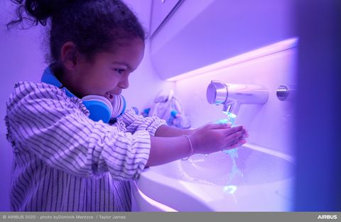 Touchless features used by child in A330neo Airspace cabin