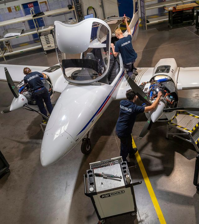 AFA - Maintenance of a Diamond DA42 Several mechanics doing maintenance of a Diamond DA42 Airbus Flight Academy aircraft in a hangar on Angoulême's airport