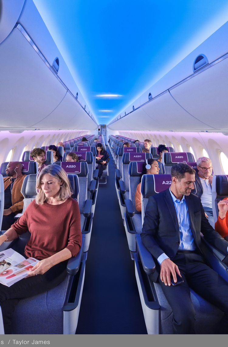 Cross-section Business Class with passengers, ambient lightling and bins Cross-section Business Class with passengers, ambient lightling and bins