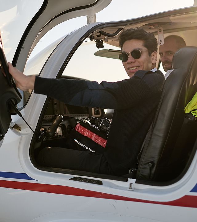 AFA - Cadet with instructor in an aircraft Smiling cadet with instructor in a Cirrus SR20 AFA aircraft on Angoulême's airport tarmac