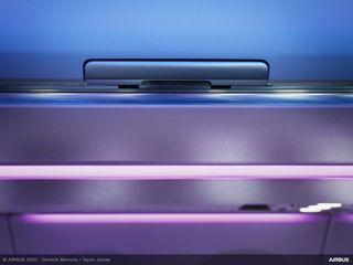 Bin latch in ambient lighting  of A320 Airspace cabin  Bin latch in ambient lighting  of A320 Airspace cabin