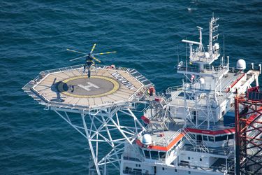An Airbus H145 lands on an offshore helideck An Airbus H145 lands on an offshore helideck
