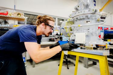 Assembly technician performing the final assembly of an H120 main module Assembly technician performing the final assembly of an H120 main module