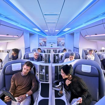 Passengers enjoying Business Class in A350XWB Airspace cabin Passengers enjoying Business Class in A350XWB Airspace cabin