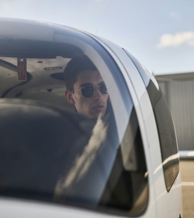 AFA - Cadet in aircraft seen through the canopy  Cadet inside of a Cirrus SR20 AFA aircraft, seen through the canopy on Angoulême's airport tarmac