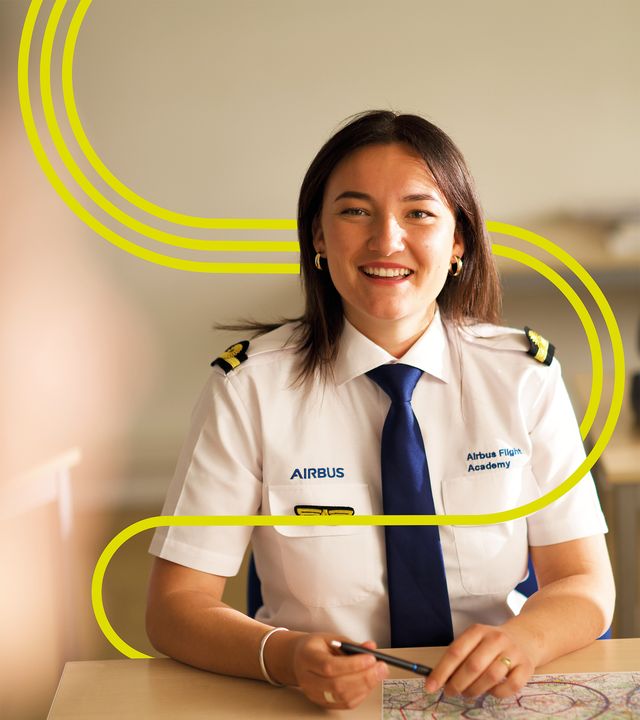 AFA - Female cadet in the classroom with stripes Cadet interacting with an instructor during an theoretical ATPL course in an Airbus Flight Academy Europe classroom
