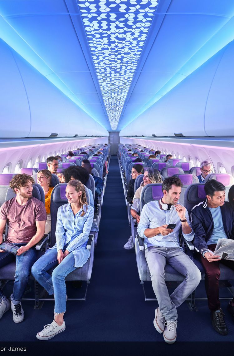 Cross-section Economy Class, XL bins, ambient lighting in A320 Airspace cabin with passengers Cross-section Economy Class, XL bins, ambient lighting in A320 Airspace cabin with passengers