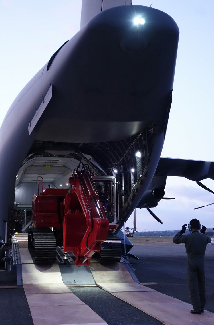 Excavator unloading from an A400M in Palu, Indonesia Excavator unloading from an A400M in Palu, Indonesia