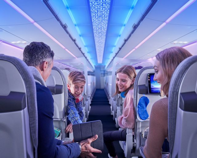 Family using tablet in Airspace A320 Cabin Family using tablet in Airspace A320 Cabin
