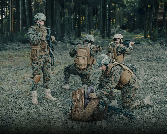 Modern Warfare Soldiers Squad are Using Drone for Scouting and Surveillance During Military Operation in the Forest. Modern Warfare Soldiers Squad are Using Drone for Scouting and Surveillance During Military Operation in the Forest.