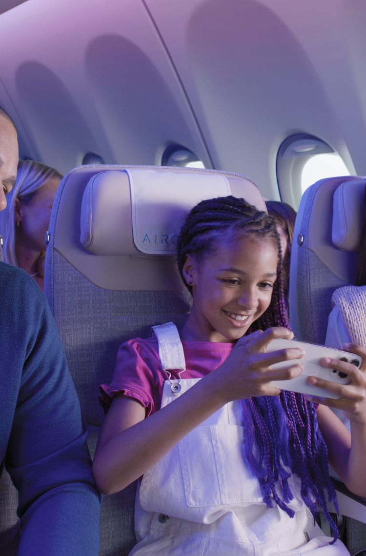 People enjoying their flight onboard the A330neo Airspace cabin. People enjoying their flight onboard the A330neo Airspace cabin.