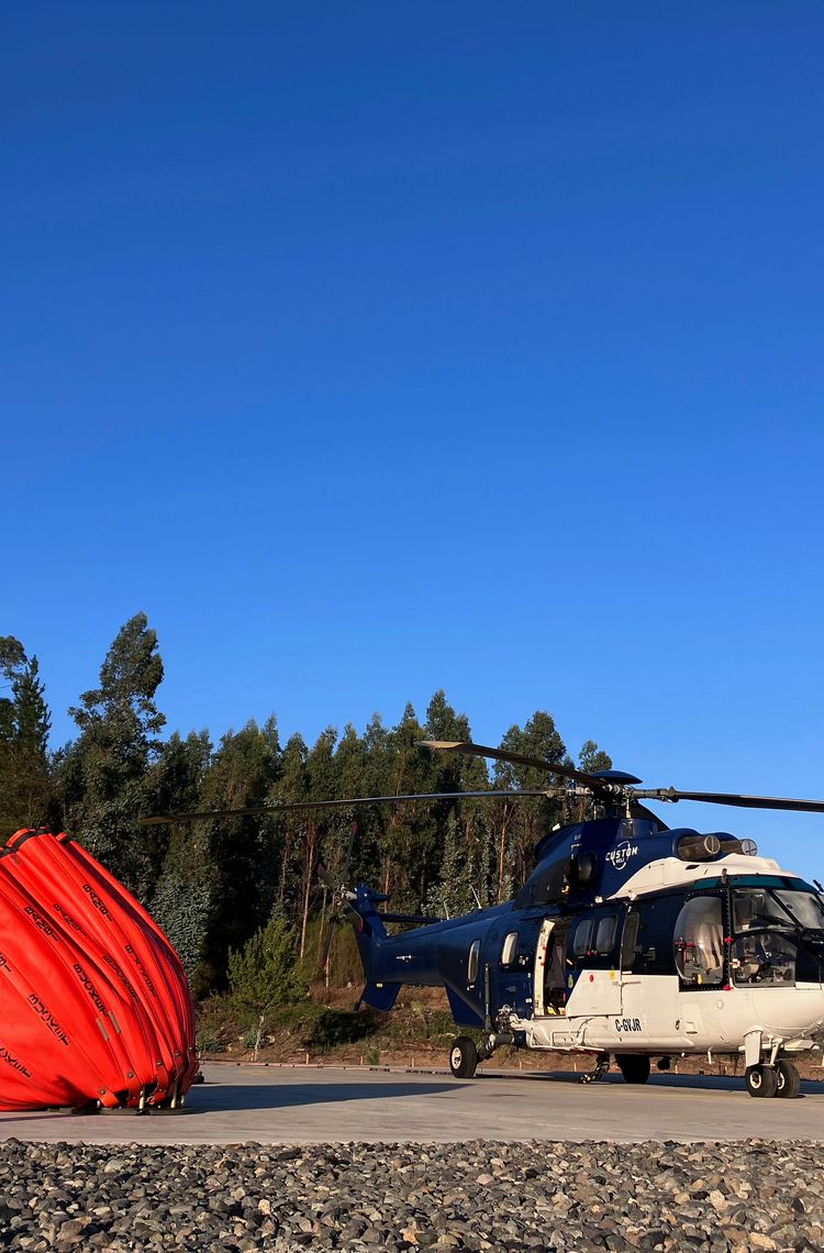 An Airbus Super Puma and water bucket An Airbus Super Puma and water bucket