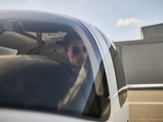 AFA - Cadet in aircraft seen through the canopy  Cadet inside of a Cirrus SR20 AFA aircraft, seen through the canopy on Angoulême's airport tarmac