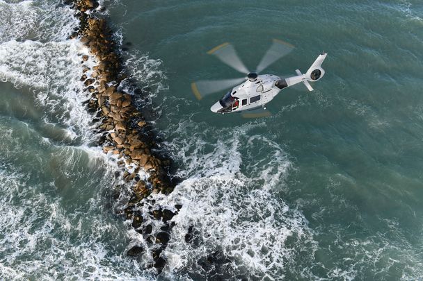 EXPH-2128-24 Helicopter over water