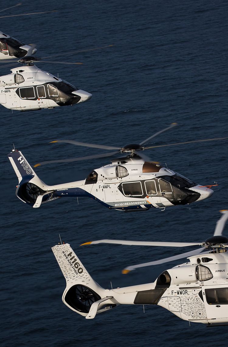 Four H160s in flight Four H160s in flight