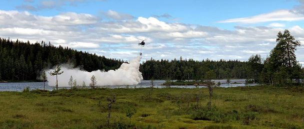 H125 Scandair helicopter sprays lime H125 Scandair helicopter sprays lime
