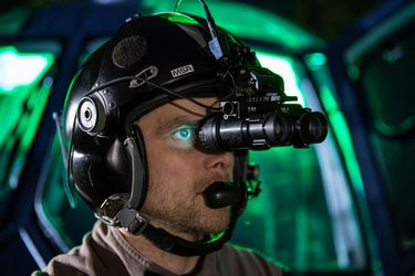 Pilot with night vision goggles (NVG) Pilot with night vision goggles (NVG)