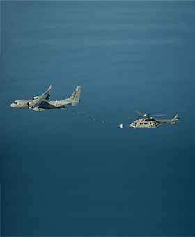 Air-to-air refuelling between C295W medium transports with a H225M Caracal helicopter Air-to-air refuelling between C295W medium transports with a H225M Caracal helicopter